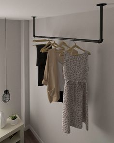 three towels hanging on a rail in a room