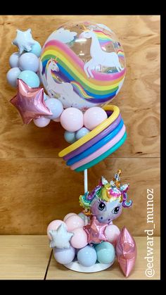 an assortment of balloons and toys on a table