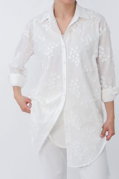 Experience true luxury with our Queen Anne Embroidery Tunic Shirt – a masterpiece crafted from fine Italian 100% cotton. This regal, long-length garment showcases a delicate Queen Anne Lace flower, inviting the essence of all seasons. Immerse yourself in the sumptuous feel of Italian craftsmanship, where elegance meets comfort in every stitch.The ensemble includes a separate off-white tank, crafted from 100% Viscose with a touch of stretch, meticulously chosen for its luxurious feel and perfect Queen Anne Lace Flower, Anne Lace Flower, Queen Anne Lace, Queen Anne's Lace Flowers, Layered Tunic, Queen Annes Lace, Italian Craftsmanship, Layering Tanks, Lace Flower