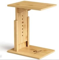 a wooden stand with two holes in the middle and one hole at the top that is open