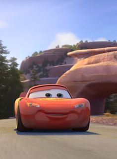 the character from cars is driving down the road