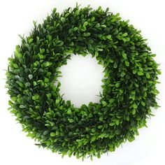 a green wreath on a white background with clippings to the top and bottom