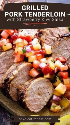 grilled pork tenderloin with strawberry kiwi salsa on a wooden cutting board