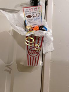 a popcorn bag tied to a door handle