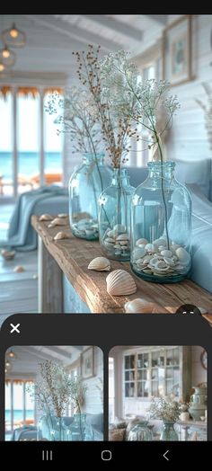 three vases filled with flowers and seashells on a table