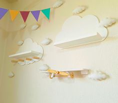 there are clouds and scissors hanging on the wall