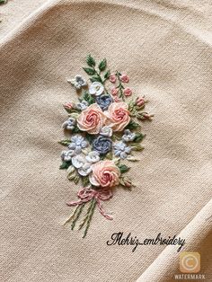 a close up of a piece of cloth with flowers on it