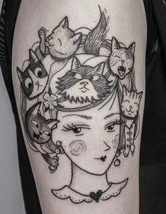 a woman with cats on her head is shown in this black and white tattoo design