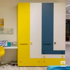 a room with yellow, blue and white painted on the walls