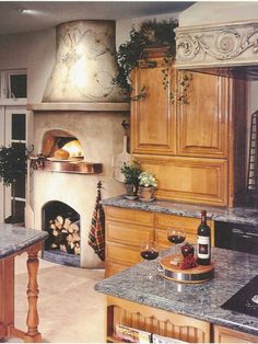 a kitchen with an oven, stove and counter tops in the middle of it's center island