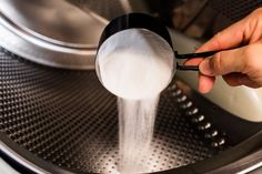 a person is pouring water into a fryer