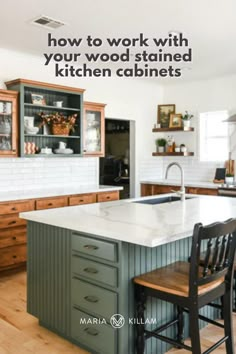 a kitchen island with two chairs next to it and the words how to work with your wood stained kitchen cabinets