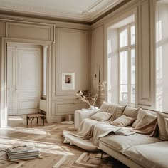 Elegant open space with neutral toned furnishings against a backdrop of cream colored walls and subtle, decorative details Modern Parisian Living Room, Parisian Chic Interior Design, Parisian Interior Style, French House Interior, Parisian Chic Interior, Modern French Interiors, Parisian Style Interior, Country French Living Room, French Style Living Room