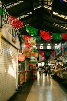 an indoor market with lots of food and decorations