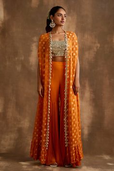 Buy Blue Cape Georgette Skirt Modal Satin Bustier Dupion Ruffle And Set For Women by Aariyana Couture Online at Aza Fashions. Cape Indian Outfit, Indian Cape Outfits, Orange Traditional Outfits, Indo Western Sangeet Outfit For Women, Orange Haldi Outfit, Haldi Indowestern Outfit, Indian Haldi Outfit