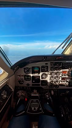 the view from inside an airplane looking at the cockpit and pilot's seat area