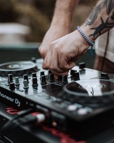 a dj mixing music with his hands