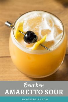 bourbon amaretto sour cocktail with lemon and black olive garnish