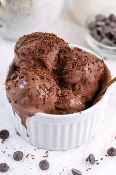 a white bowl filled with chocolate ice cream