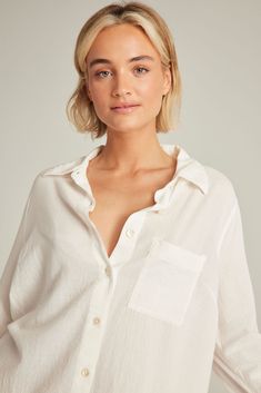 A lightweight organic cotton shirt that's as versatile as it is comfortable.  The perfect staple to take you from bed to beach. A relaxed classic silhouette crafted in organic cotton with mother-of-pearl buttons and a lightweight finish. Pair with The Classic Boxer, The Classic Trouser or simply wear alone.  Crafted with 100% natural materials. Embroidery detail on top back Made from GOTS certified cotton Mother-of-pearl buttons Relaxed fit 100% natural materials Machine Wash Cold.  Hang Dry. Cotton Shirttail Hem Top For Vacation, Comfortable Relaxed Fit Tops For Vacation, Relaxed Fit Cotton Blouse For Loungewear, Comfortable White Beach Tops, Beach Cotton Tops With Shirttail Hem, Cotton Beach Tops With Shirttail Hem, Comfortable Long Sleeve Beach Tops, Effortless Relaxed Fit Blouse For Loungewear, Summer Relaxed Fit Shirt For Loungewear