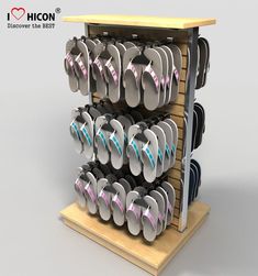 a display case filled with lots of flip flops on top of a wooden shelf