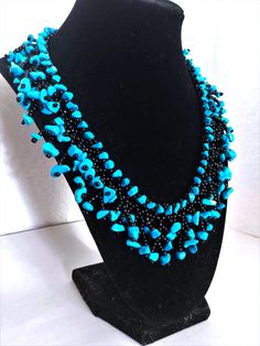 A handmade glass beaded necklace that is perfect for any occasion: parties, holidays, birthdays, anniversaries. All products are hand-crafted by my mother. Dimensions: - Length: 28.5 cm - Width: 22.0 cm - Height: 2.0 cm Lightweight, high quality with a beaded hook as a clasp.  Acrylic Pearls: 8 mm. Will respond to concerns and suggestions promptly. Shipping costs: Free Domestic Shipping. All orders are sent by air-mail with tracking number. Time of delivery: Estimated 1-3 days for domestic shipping; international make take 7-14 days. Feel free to check out our other similiar products! Link: https://noorsjewelers.etsy.com Handmade Glass Beads, Beaded Choker Necklace, Necklace Statement, Seed Pearl, Glass Bead Necklace, Anniversary Wedding, Beaded Choker, My Mother, Black Glass