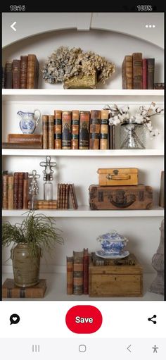 the shelves are filled with books and vases