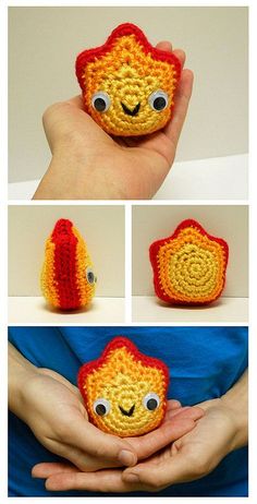 there is a crocheted orange and red object in the palm of someone's hand