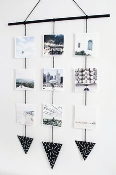 a white wall with pictures hanging from it's sides and photos on the side