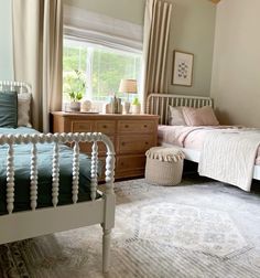 a bedroom with two twin beds and a rug