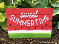 a wooden sign that says, sweet summertime with watermelon slices painted on it