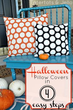 a blue chair with two pillows on it and an orange polka dot pillow in the middle