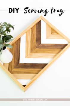 a wooden tray with some plants in it and the words diy serving tray above it