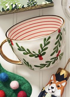 a cup and some ornaments on a table