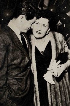 an old black and white photo of two people