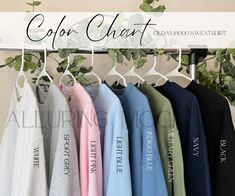 several shirts hanging on a rack with the words color chart in black and white above them