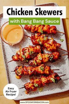 chicken skewers with bang bang sauce on a plate