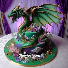 a cake decorated with flowers and a green dragon