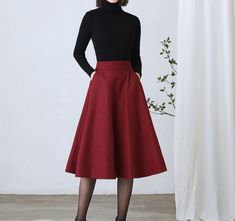 "So classic wine red wool skirt mostly makes you look feminine, suggest to wear with solid winter blouse or coat, warm and comfortable. ★★ FEATURES * 25% wool, other fiber, nylon * Polyester lining * Two side pockets * Right zipper closure * back little elastic waist skirt * A Line wool Skirt * Midi wool sirt * Perfect for Winter, autumn * Dry clean ★★ The model is 170 cm (5′ 7″) tall with a 80 cm (31.5\") bust, 66 cm (26\") waist. She is wearing the burgundy wool skirt in size XS. ★★Bespoke Ord Red Lined Skirt For Winter, Burgundy Skirt For Fall, Burgundy Flared Lined Skirt, Red Knee-length Skirt For Fall, Elegant Burgundy Midi Skirt, Red Full Skirt Bottoms For Fall, Elegant Burgundy Pleated Skirt, Red Winter Skirt With Relaxed Fit, Red Winter Midi Skirt