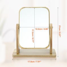 a wooden stand with a mirror on it's side and measurements for the frame