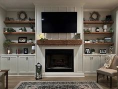 a living room filled with furniture and a flat screen tv mounted on the wall above a fireplace