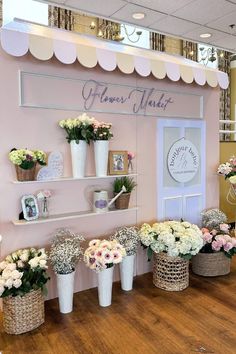 flower market display with flowers in baskets on shelves