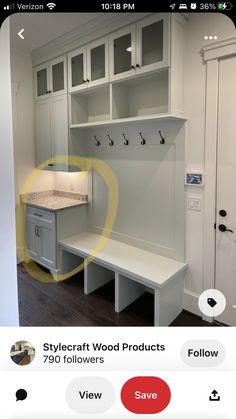 a white room with lots of cabinets and drawers