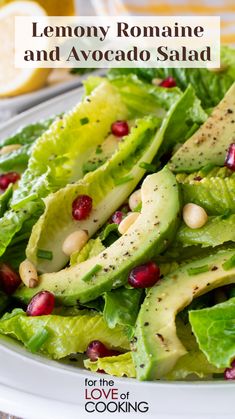 lettuce and avocado salad with pomegranates on top