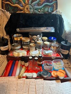 an open suitcase filled with different types of food and condiments on top of a table