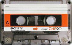 an orange and white cassette with the words sony on it