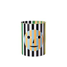 a striped cup with a face painted on the front and bottom, sitting in front of a white background