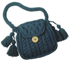 a blue purse with tassels and a button