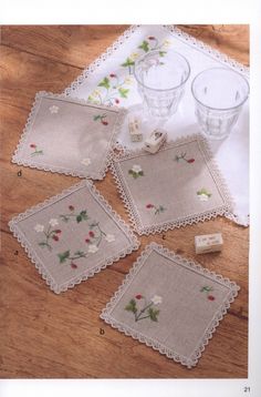 four placemats and two glasses on a table