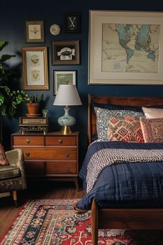 a bed room with a neatly made bed and lots of pictures on the wall above it